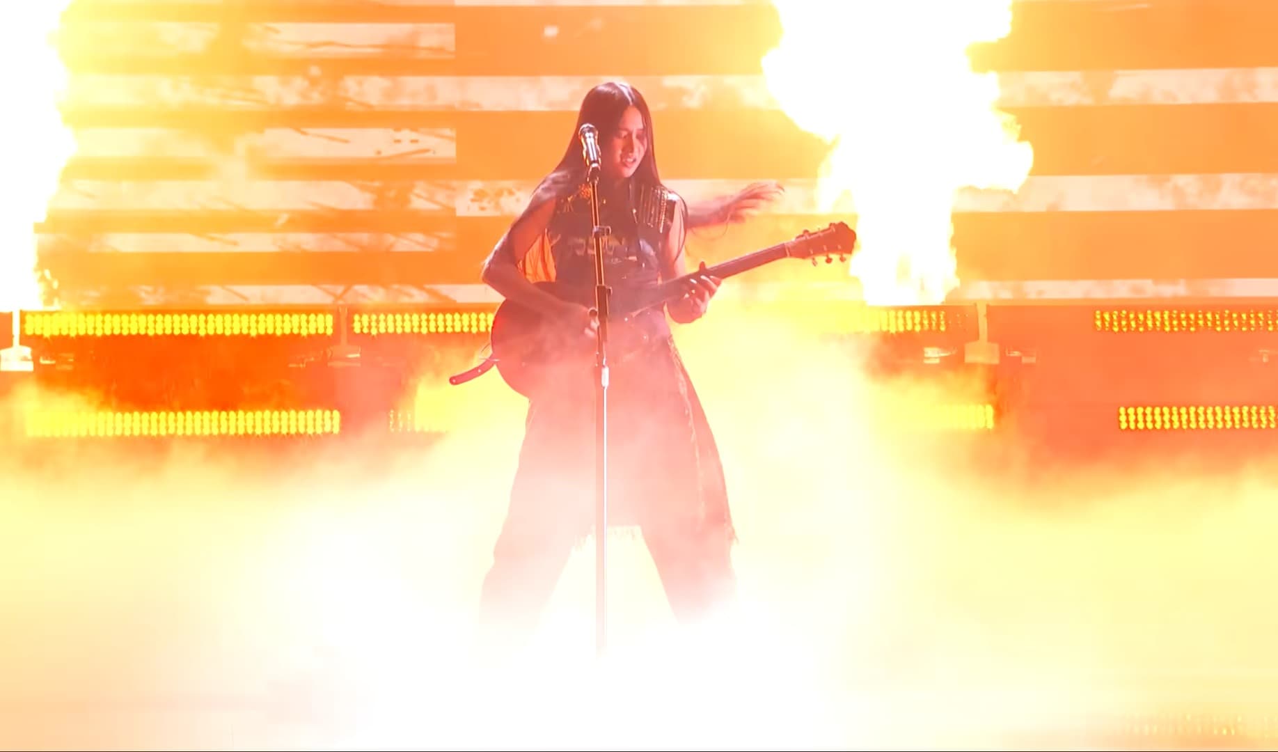 Nene Royal playing electric guitar on the America's Got Talent stage
